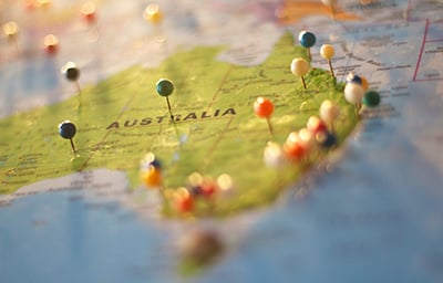 Map of Australia with drawing pins in it