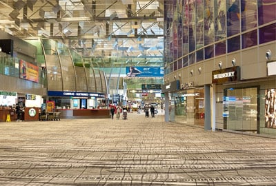 interior shot of singapore changi airport terminal building, showing modern design and high ceilings