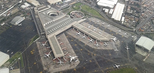 birds eye view of mexico city international airport showing airlines on tarmac and airport concourses
