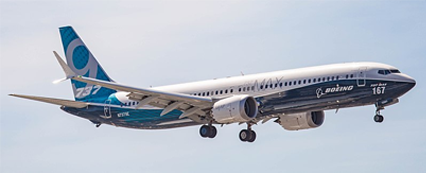 Boeing 737 MAX 9 aircraft, with no branding, flying 