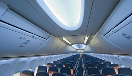 Interior of the Boeing 737 MAX, focusing on the sculpted sidewalls and larger baggage bins