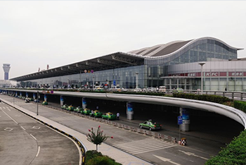 Image of terminal 1 exterior, showing passenger balcony, and modern glass design 