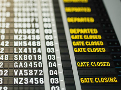 A flight departure board, displaying the notice that gates have closed and are closing