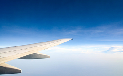 A plane wing with blue sky