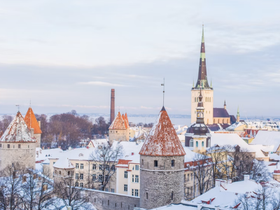 A city shot of the red roofs of buildings in Tallin in Snow